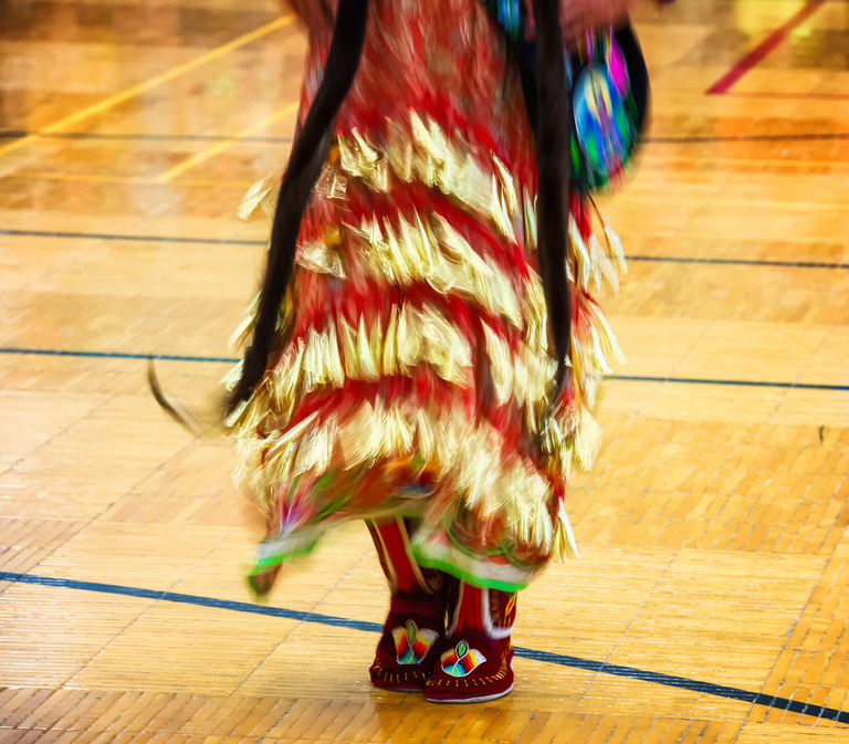 A person dancing in traditional attire